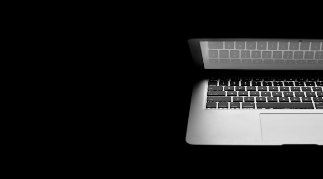 a laptop computer with a black background