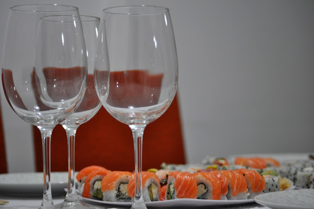 salmon sushi with wine glasses