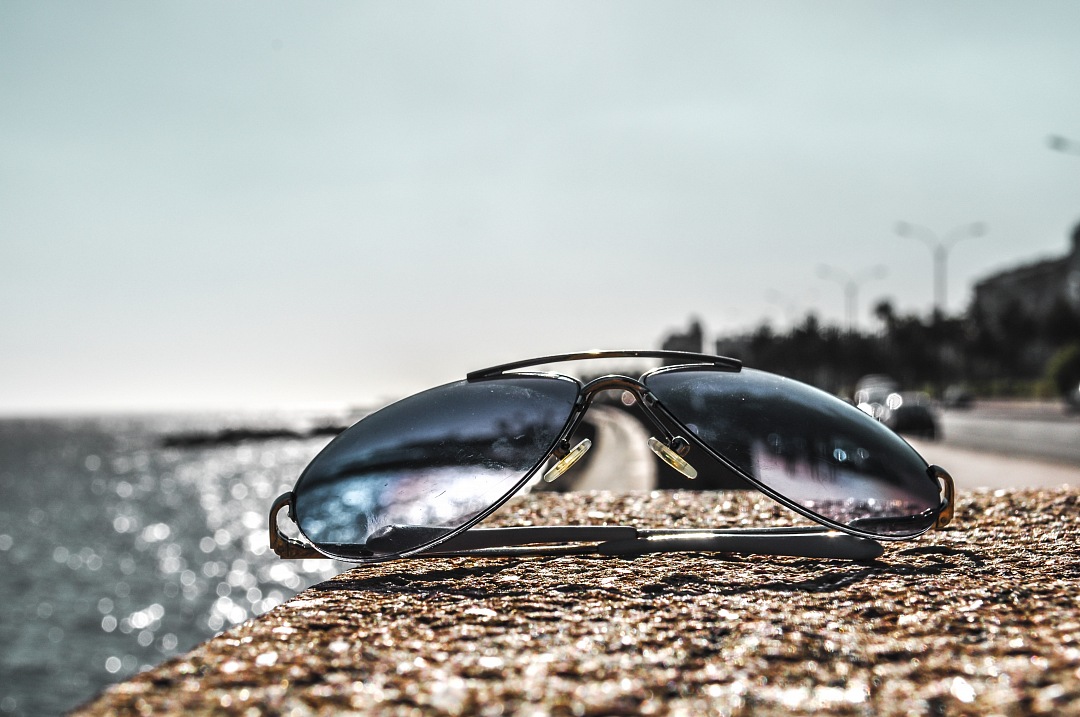 closeup of sunglasses on a wall