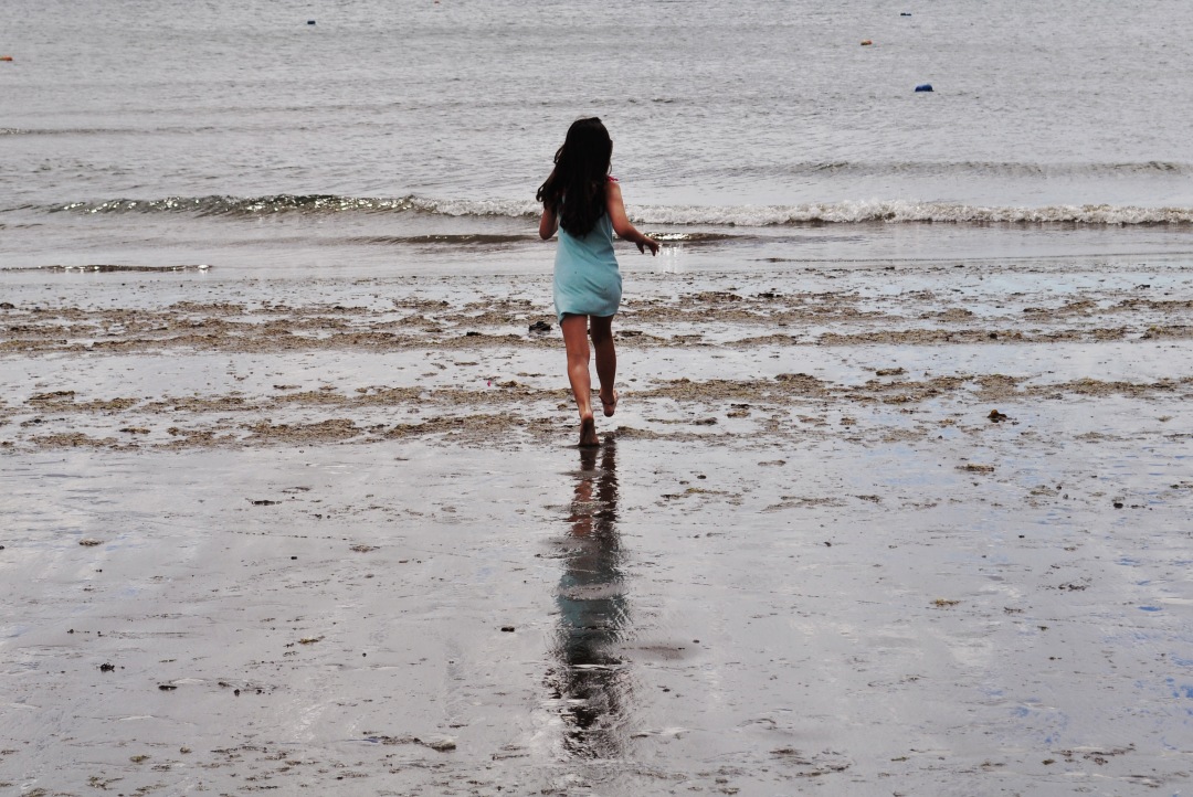 girl walking on the beach Valdes Peninsula 