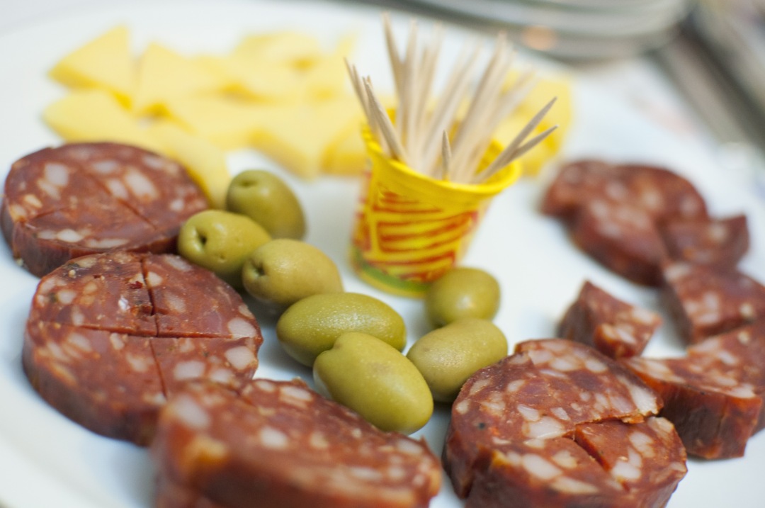 Italian snack salami with olives and herbs