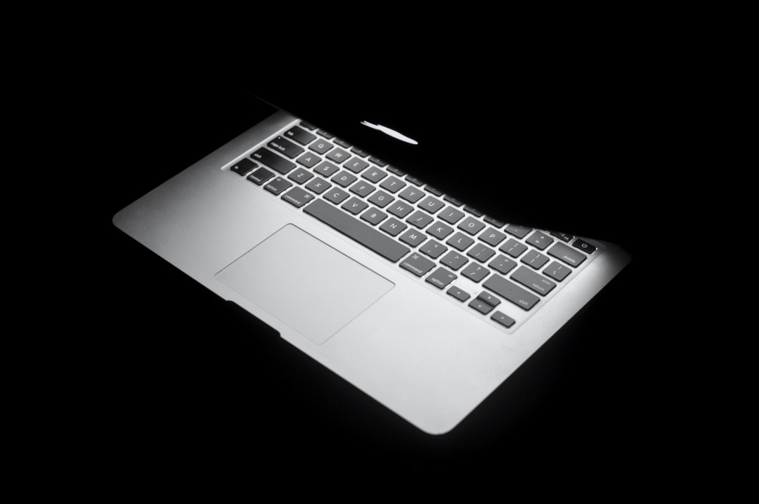 a laptop computer with a black background