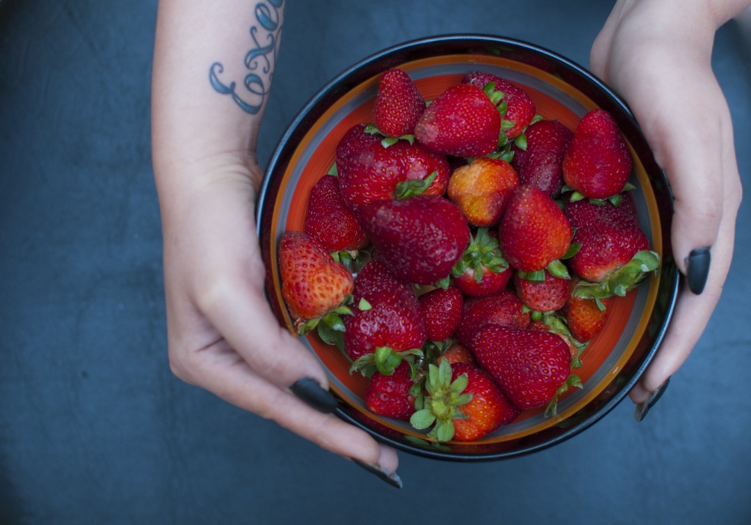 Woman with Delicious Red strawberry