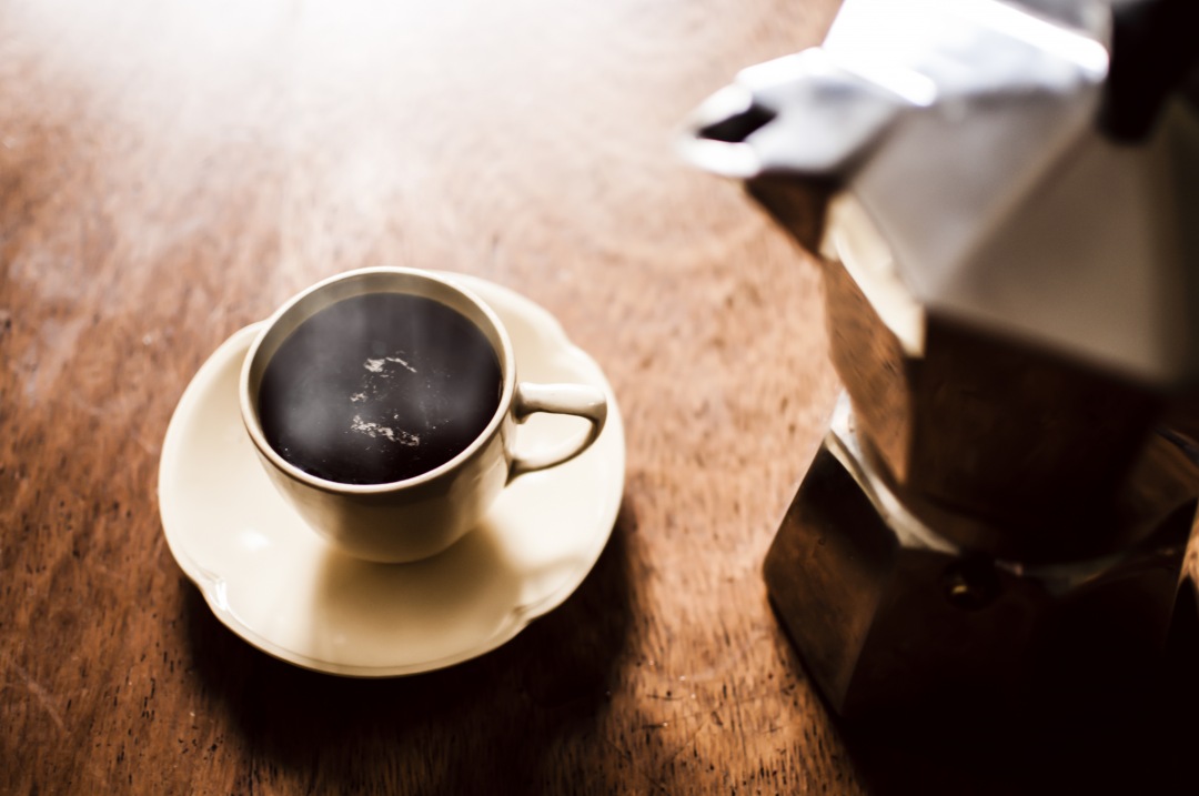 Coffee and Espresso maker on vintage background (cafe)
