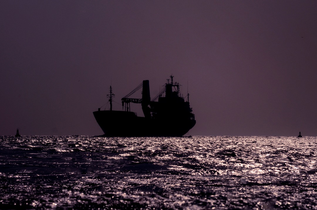 silhouette of boat in the sea