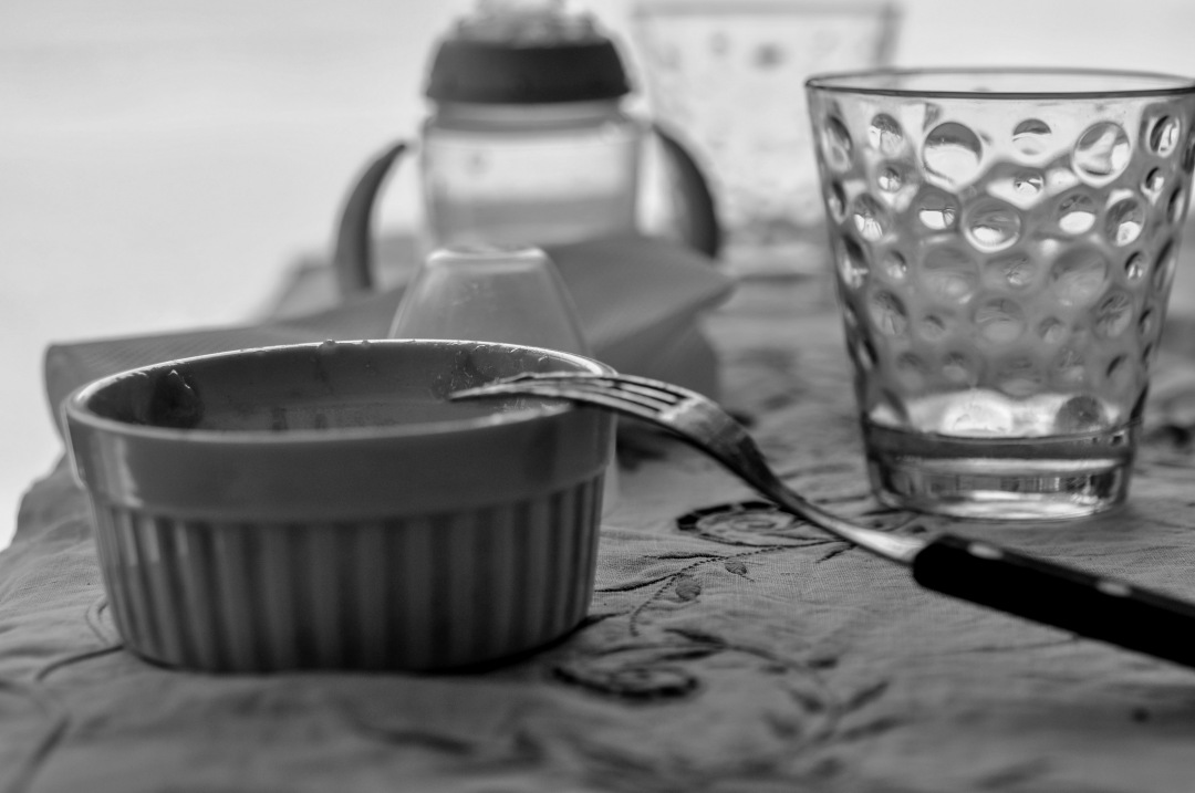 a table with a glass and a knife