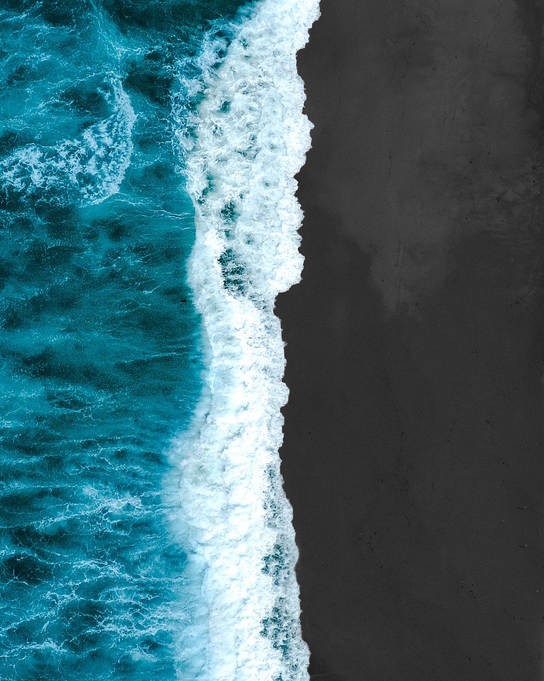 Aerial View blue and black beach