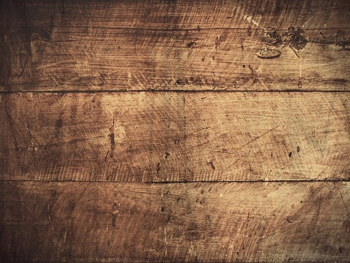a wooden background with a dark brown wood texture