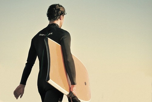 Surfer man walking