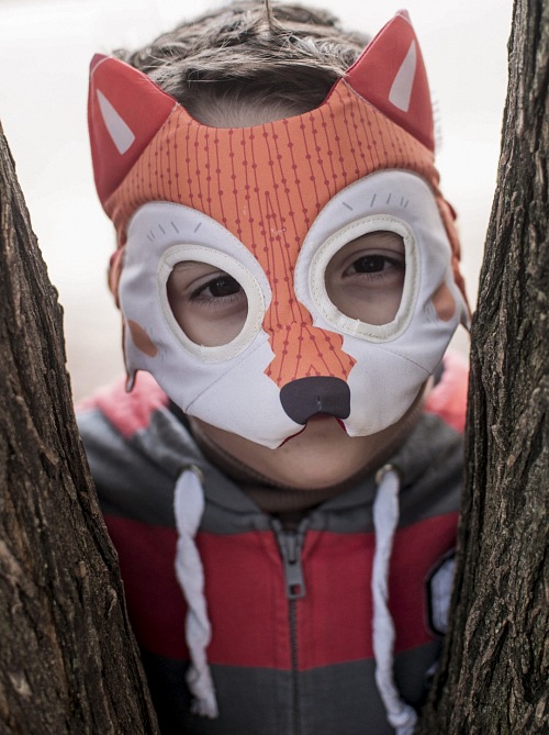 Child with fox costume Playing