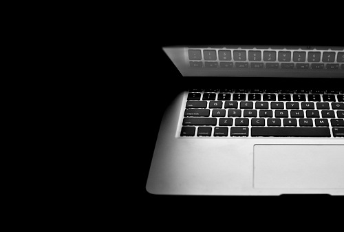 Macbook air on black background