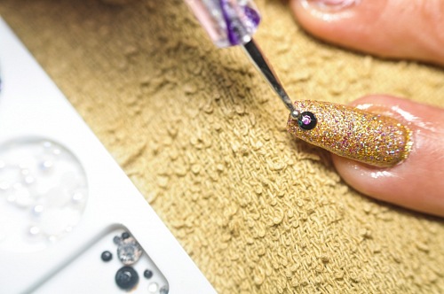 Beautician painting customer's nails. Manicure. Hairdressing salon and Beauty Clinic